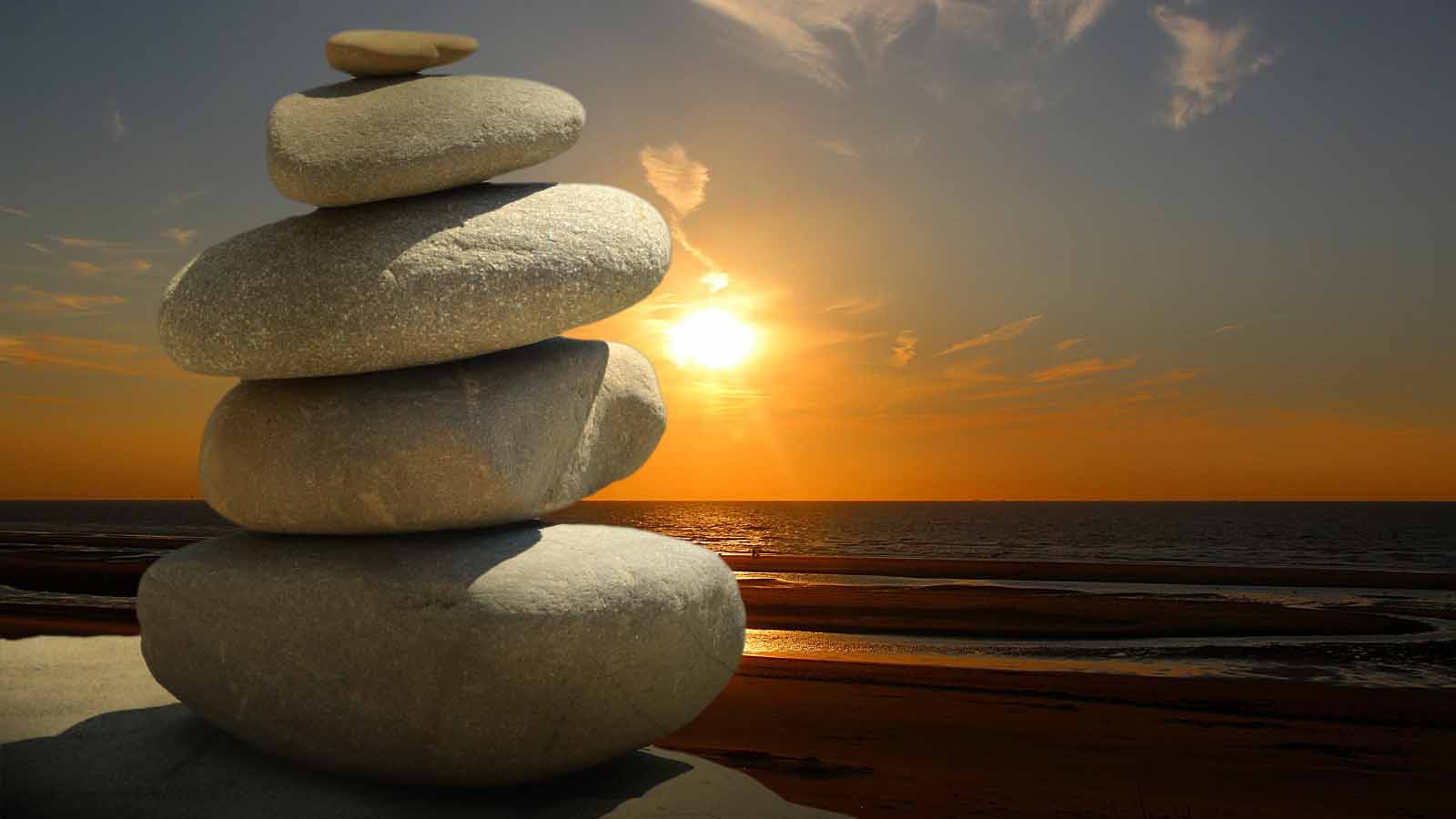 stacked rocks with sunset